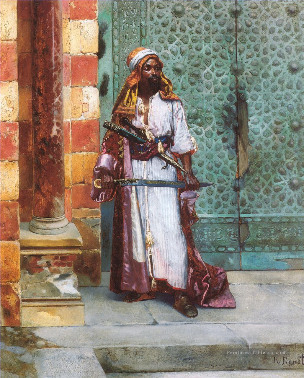 Garde debout Arabe peintre Rudolf Ernst Peintures à l'huile